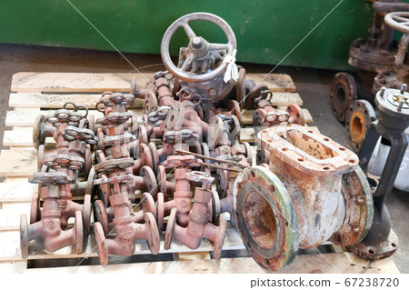 Large rusty old metal gate valve, pipe fittings 67238720