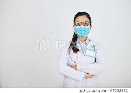 Confident serious general practitioner 67238882