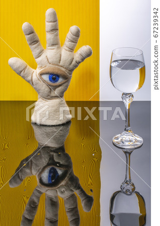 Protective amulet in the shape of an open palm and eye made of felted wool with reflection and a glass Protective amulet in the shape of an open palm and eye made of felted wool with reflection and a glass 67239342
