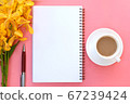 Top view or flat lay of open notebook paper, yellow orchid flowers, pen and a cup of coffee on pink background. 67239424