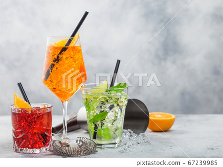 Glasses of spritz,mojito and negroni cocktails 67239985