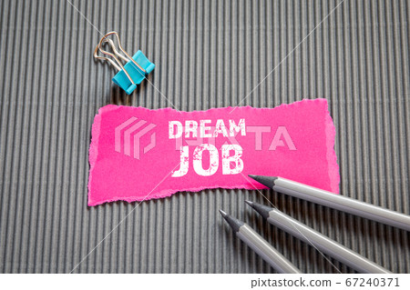 DREAM JOB. Career, education and job interview concept. Text on torn, colored paper DREAM JOB. Career, education and job interview concept. Text on torn, colored paper 67240371