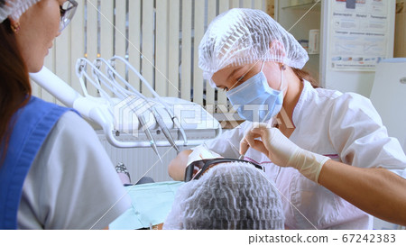 Young woman at dental clinic Young woman at dental clinic 67242383