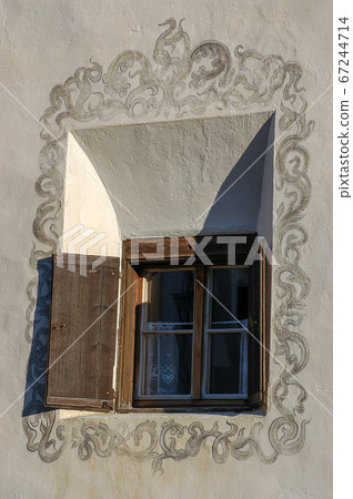 Ancient Wooden Window in Guarda village - Engadine Switzerland Ancient Wooden Window in Guarda village - Engadine Switzerland 67244714