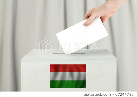 Hungarian Vote concept. Voter hand holding ballot 67244785