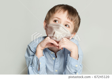 Little child boy in protective medical mask  67245120