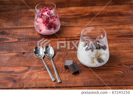 Two portions of vanilla and strawberry ice cream Two portions of vanilla and strawberry ice cream 67245250
