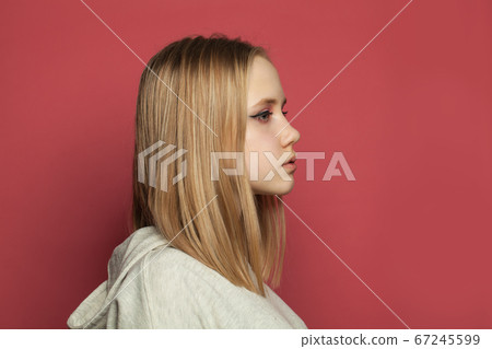 Beautiful girl with makeup on vivid pink Beautiful girl with makeup on vivid pink 67245599