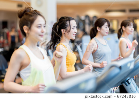 Young woman, gym, running machine 67245816