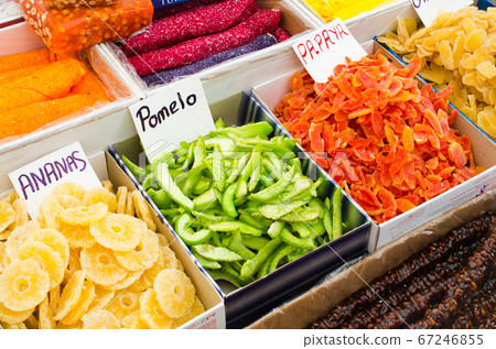 Colored sweet slices of candied fruit. Various dried fruits and eastern sweets on market. 67246855