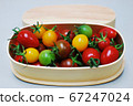 Colorful tomatoes in a wooden box 67247024