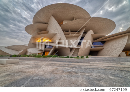Doha, Qatar-November 16,2019 :National Museum of Qatar (Desert rose) panoramic  view at sunset 67247199