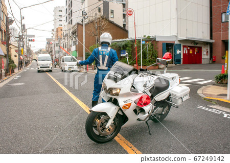 Traffic regulation for road blockade by motorcycle 67249142