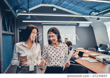 Two business women are talking in office 67249697