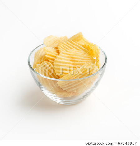 Crunchy potato snack. Chips in bowl isolated on white background Crunchy potato snack. Chips in bowl isolated on white background 67249917