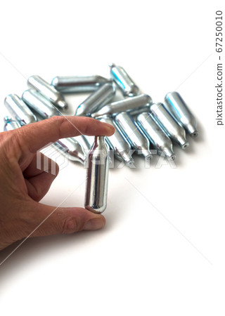 Closeup of hilarious gas n2o in metallic siphon Closeup of hilarious gas n2o in metallic siphon 67250010