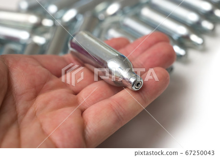 Closeup of hilarious gas n2o in metallic siphon Closeup of hilarious gas n2o in metallic siphon 67250043