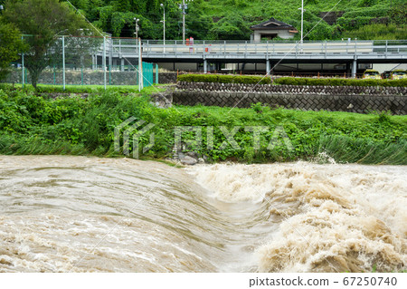 Tenryu river after heavy rain in Iida city Tenryu river after heavy rain in Iida city 67250740