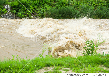 Tenryu river after heavy rain in Iida city Tenryu river after heavy rain in Iida city 67250741