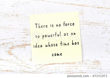 Yellow sticky note on wooden wall with wise quote Yellow sticky note on wooden wall with wise quote 67251971