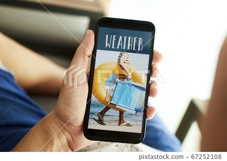 man and text weather in his smartphone 67252108
