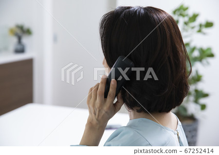 Rear view of a woman calling Rear view of a woman calling 67252414