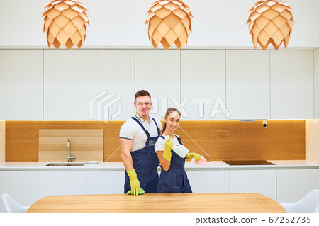 Portrait of professional cleaners team in kitchen Portrait of professional cleaners team in kitchen 67252735