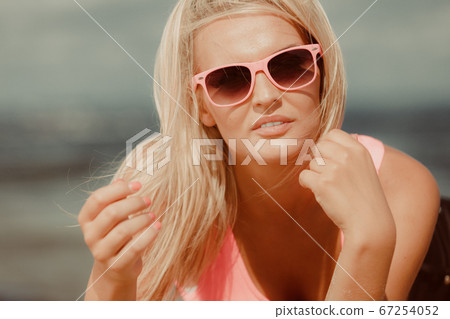Young girl on beach. Young girl on beach. 67254052