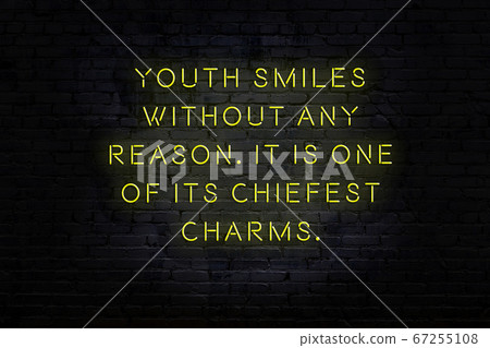 Wise quote. Neon inscription against brick wall Wise quote. Neon inscription against brick wall 67255108