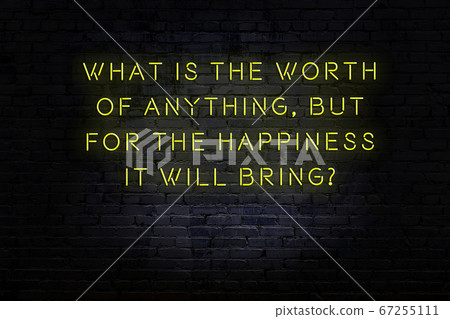 Wise quote. Neon inscription against brick wall Wise quote. Neon inscription against brick wall 67255111