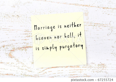 Wise quote on sticky note on wooden wall Wise quote on sticky note on wooden wall 67255724