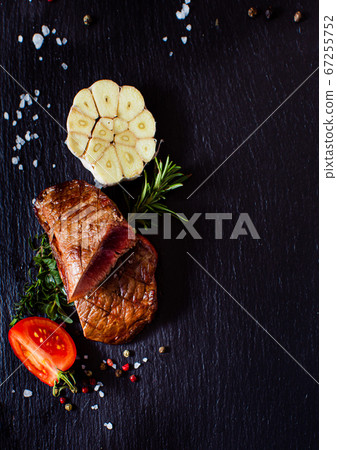 Tasty grilled steak with vegetables and spices Tasty grilled steak with vegetables and spices 67255752