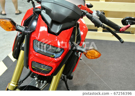 KUALA LUMPUR, MALAYSIA -MARCH 31, 2018: Motorcycle headlamps. Designed specifically to give enough vision for the rider during daytime and night.     67256396