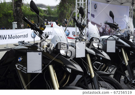 KUALA LUMPUR, MALAYSIA -FEBRUARY 25, 2018: BMW motorcycle and brand logos. BMW is one of the famous motorcycles manufactures in the world from Germany.  KUALA LUMPUR, MALAYSIA -FEBRUARY 25, 2018: BMW motorcycle and brand logos. BMW is one of the famous motorcycles manufactures in the world from Germany.  67256519