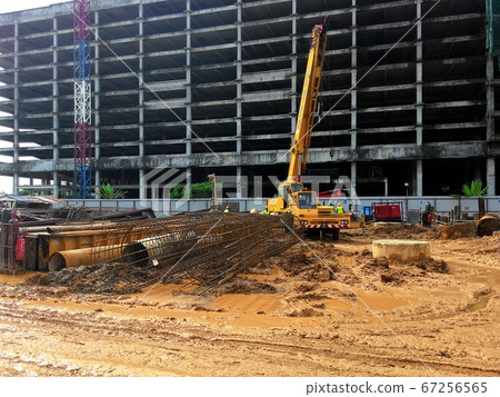 KUALA LUMPUR, MALAYSIA -JULY 01, 2017: Bore pile driving work by bore pile rig at the construction site. The machine used to driven pile for building foundation work. 67256565