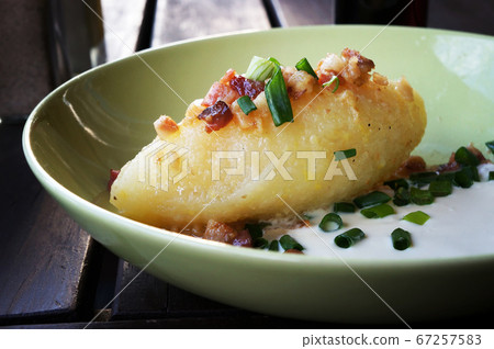 Cepelinai (zeppelin) with sour cream, cracklings Cepelinai (zeppelin) with sour cream, cracklings 67257583