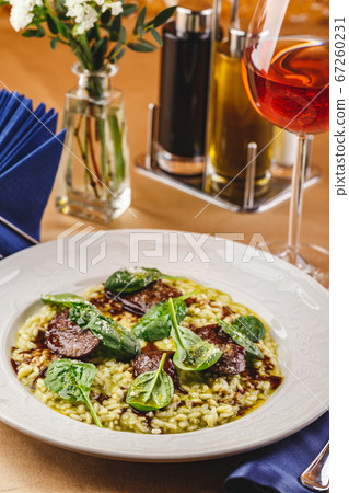 Risotto with spinach and chicken liver Risotto with spinach and chicken liver 67260231