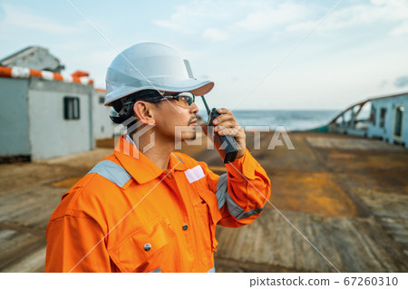 Filipino deck Officer on deck of vessel or ship , wearing PPE personal protective equipment Filipino deck Officer on deck of vessel or ship , wearing PPE personal protective equipment 67260310