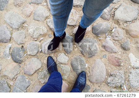 Male and female legs in leather shoes Male and female legs in leather shoes 67261279