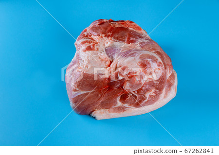 Raw pork leg isolated on blue background Raw pork leg isolated on blue background 67262841