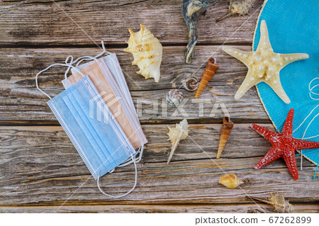 Travel vacation during the covid-19 coronavirus quarantine summer vacation after pandemic crisis beach hat medical mask shells Travel vacation during the covid-19 coronavirus quarantine summer vacation after pandemic crisis beach hat medical mask shells 67262899
