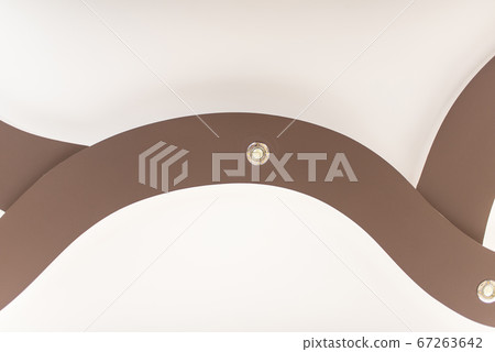 Stretch ceiling in light brown color with lamps. Stretch ceiling in light brown color with lamps. 67263642
