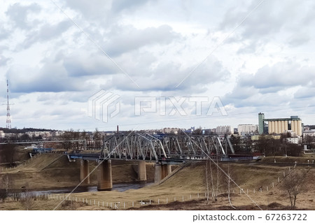 Old railway bridge in the city limits. 67263722