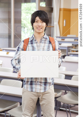 Male college student with message board Male college student with message board 67264989