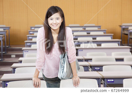 Smiling female college student 67264999