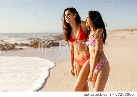 Caucasian women having fun on the beach Caucasian women having fun on the beach 67268800