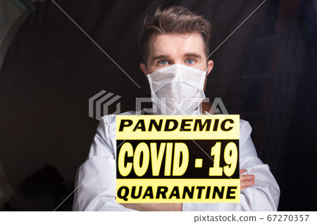 Medicine and health care concept. Man doctor in hospital. Doctor wearing protective mask checking and take care infected people from covid-19. 67270357
