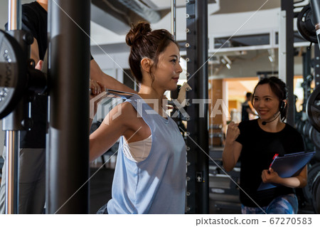 Young woman, muscle training, gym Young woman, muscle training, gym 67270583