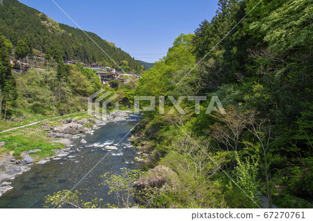 A view of the fresh green Mitake Valley, a suspension bridge over the Tama River, downstream from the Kinobashi Bridge A view of the fresh green Mitake Valley, a suspension bridge over the Tama River, downstream from the Kinobashi Bridge 67270761