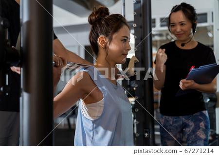 Young woman, muscle training, gym 67271214